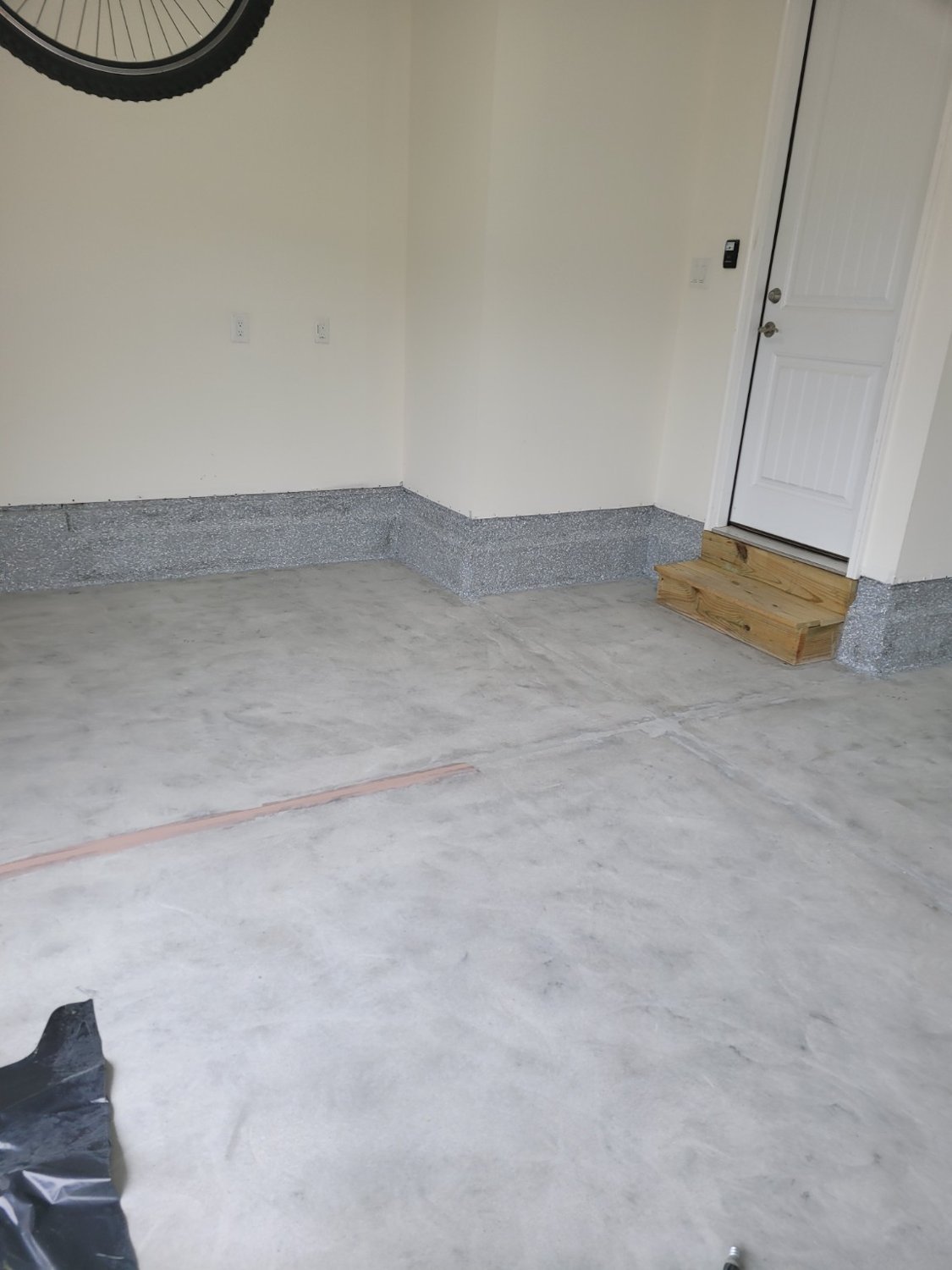 Gray flake garage floor — before